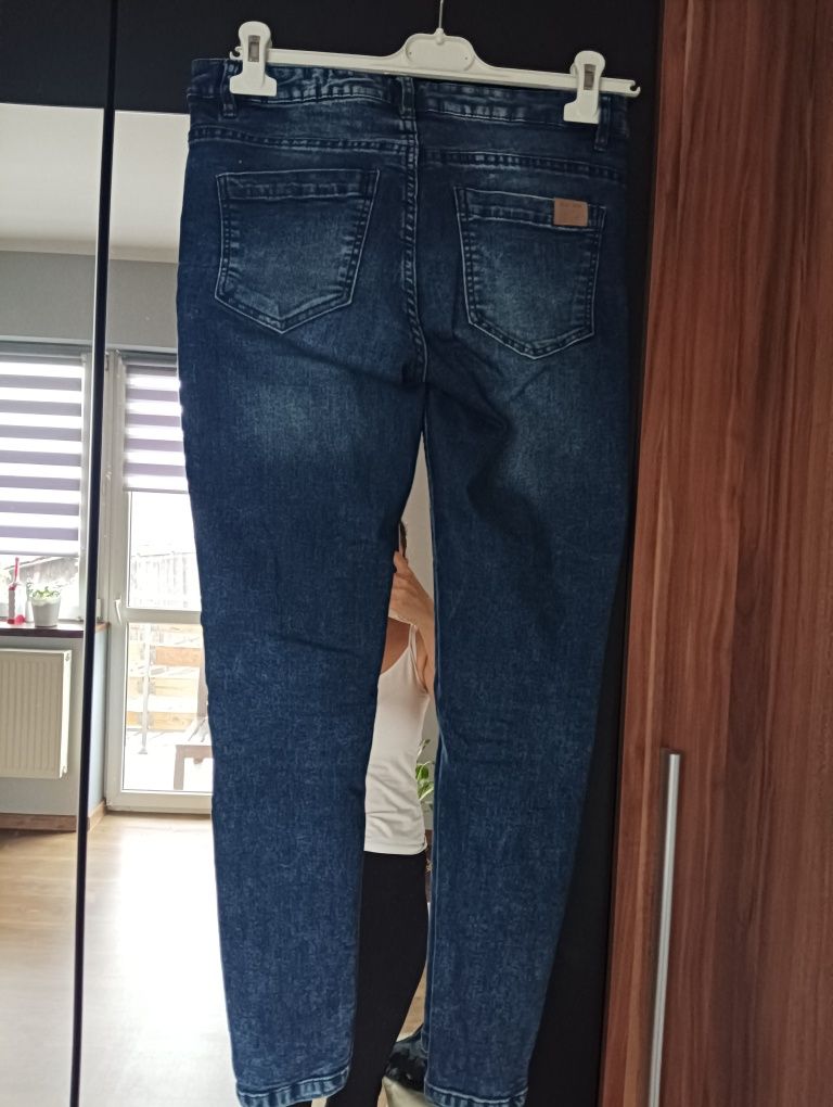 Spodnie jeansowe z rozcięciem Cropp 36