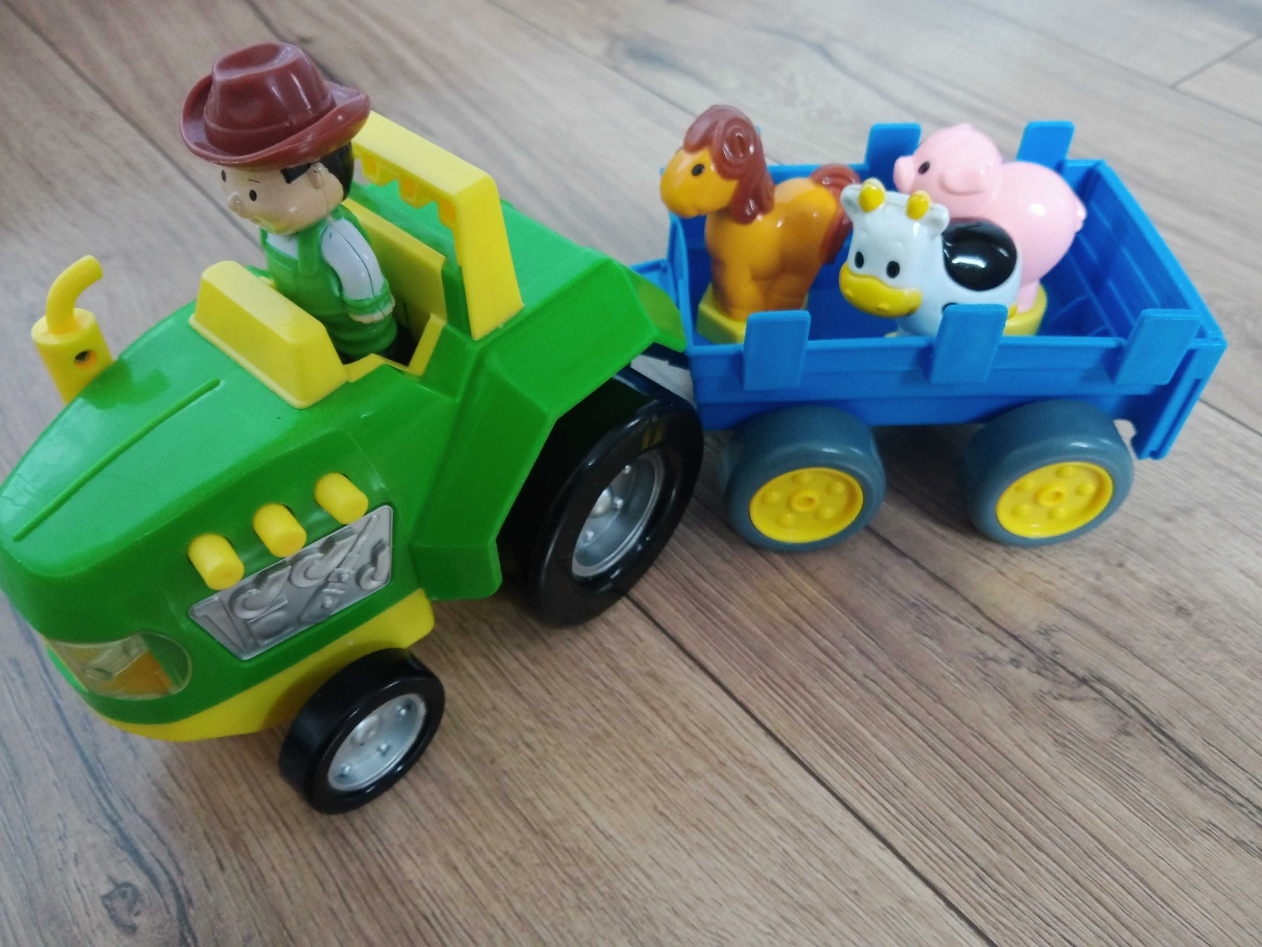 Traktor z przyczepka gra świeci farma zwierzątka