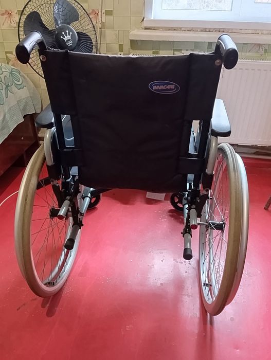 Инвалидная коляска .