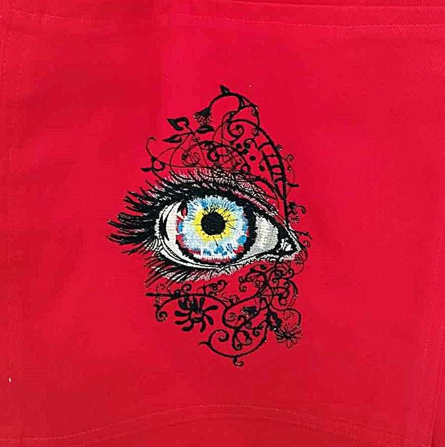 Czerwona bawełniana torba z kieszeniami i haftem