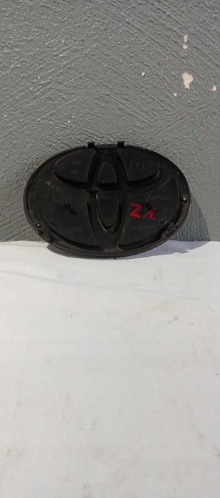 Emblemat Logo Znaczek Toyota Yaris II Emblemat Zderzaka 753.11-000.30