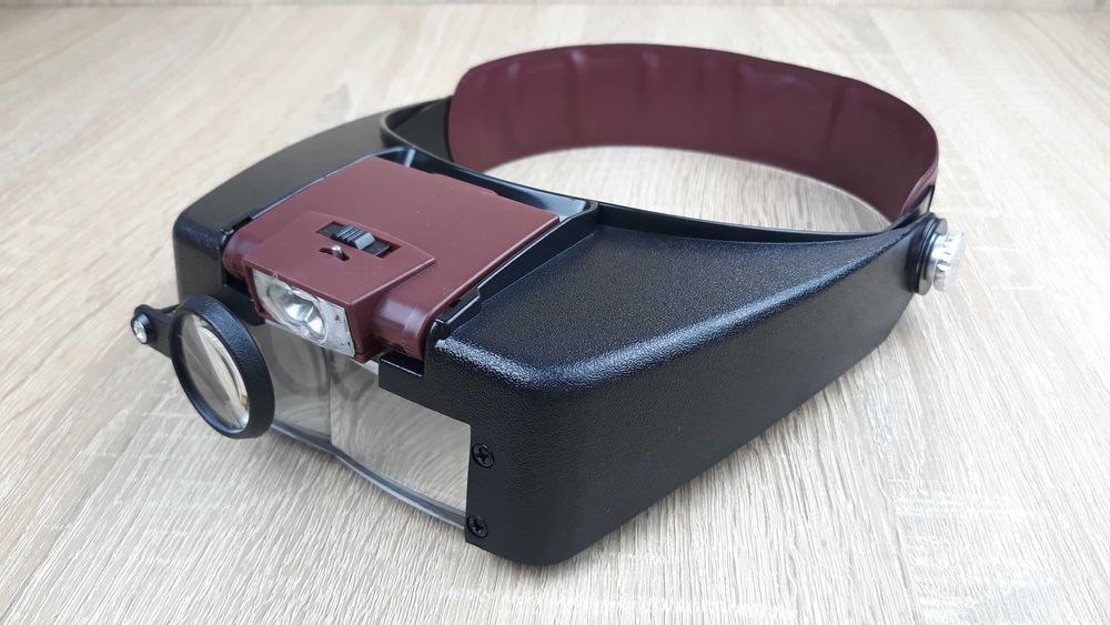 Бінокулярна налобна лупа з підсвічування