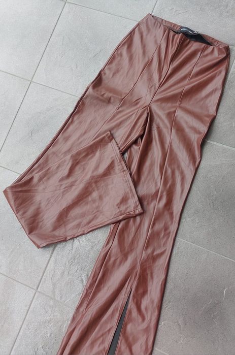 Spodnie skórzane eko skóra latex szerokie nogawki rozcięcia S 36 Nowe