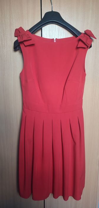 Rozkloszowana sukienka z kokardami na wesele KM112

Kartes