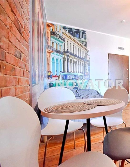 Doskonale wyposażona loftowa kawalerka z patio w  Centrum