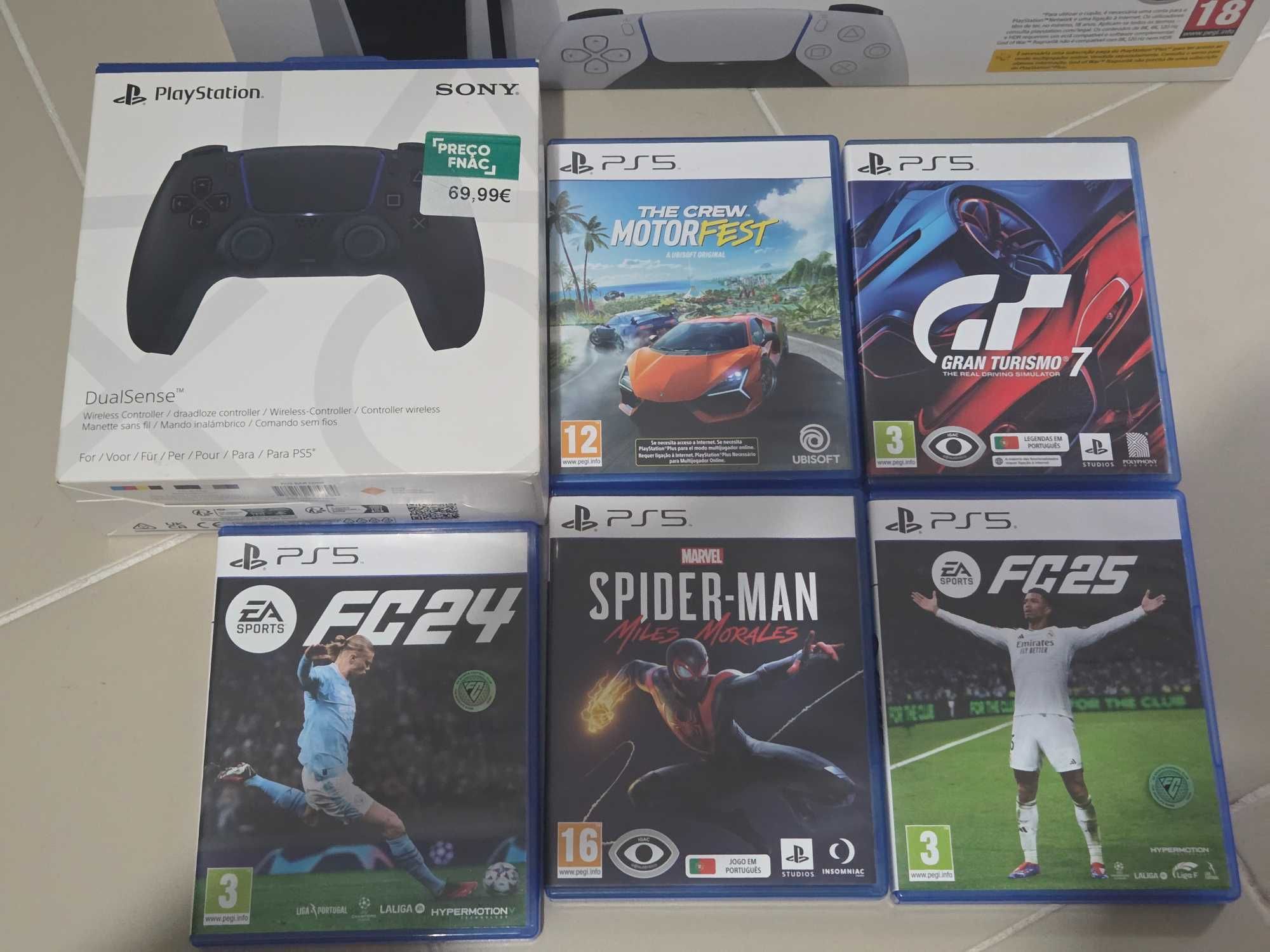 Playstation 5 com 5 jogos + 2 comandos seg.garantia dezembro 2028