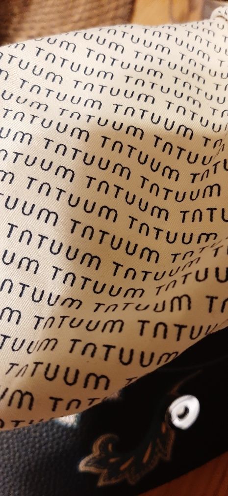 Torebka listonoszka, Tatuum