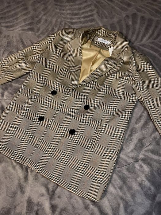 Класичний піджак у клітинку