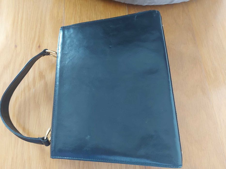 Malote de mão em pele