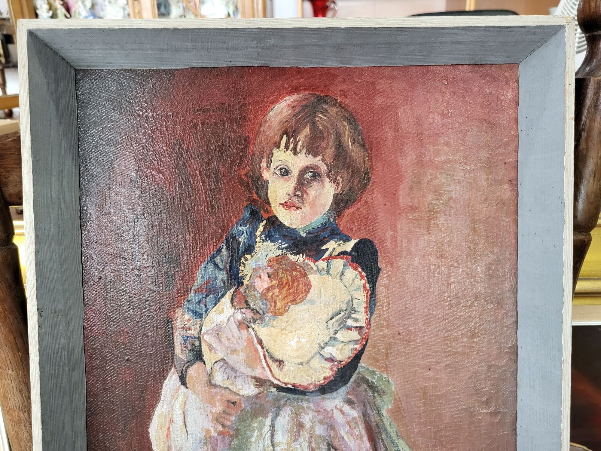Stary olejny obraz z motywem dziewczynki z lalką