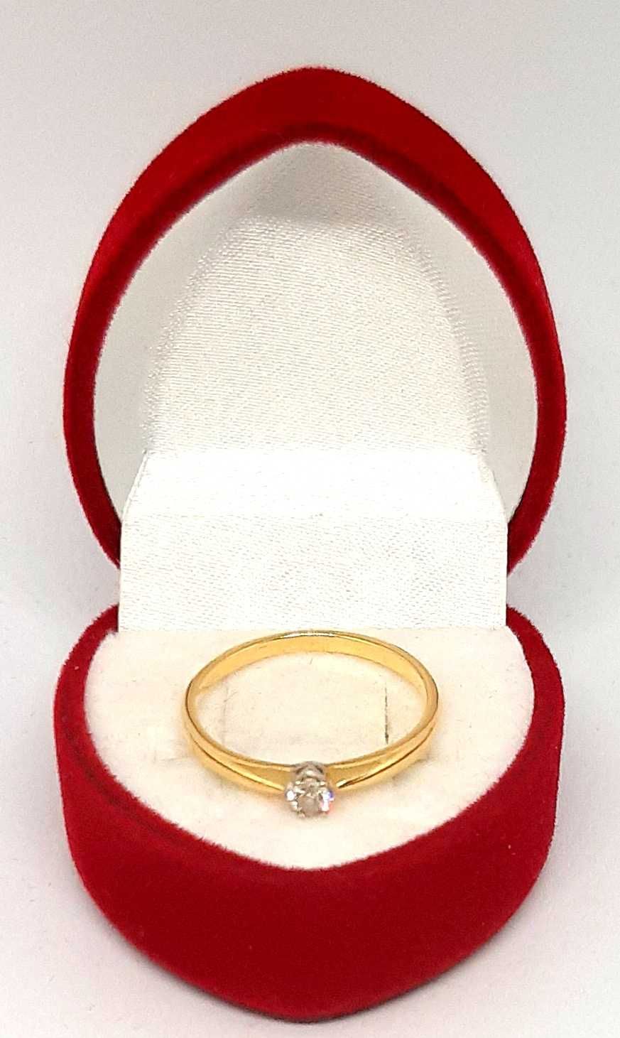 Złoty pierścionek z Brylantem 0,08ct PR.585 W:1,51gr R.12 ,