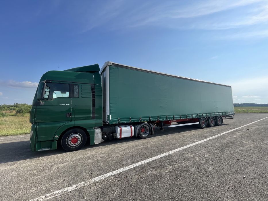 Тягач Man TGX 18.440 MEGA + напівпричіп штора Kassbohrer осі SAF