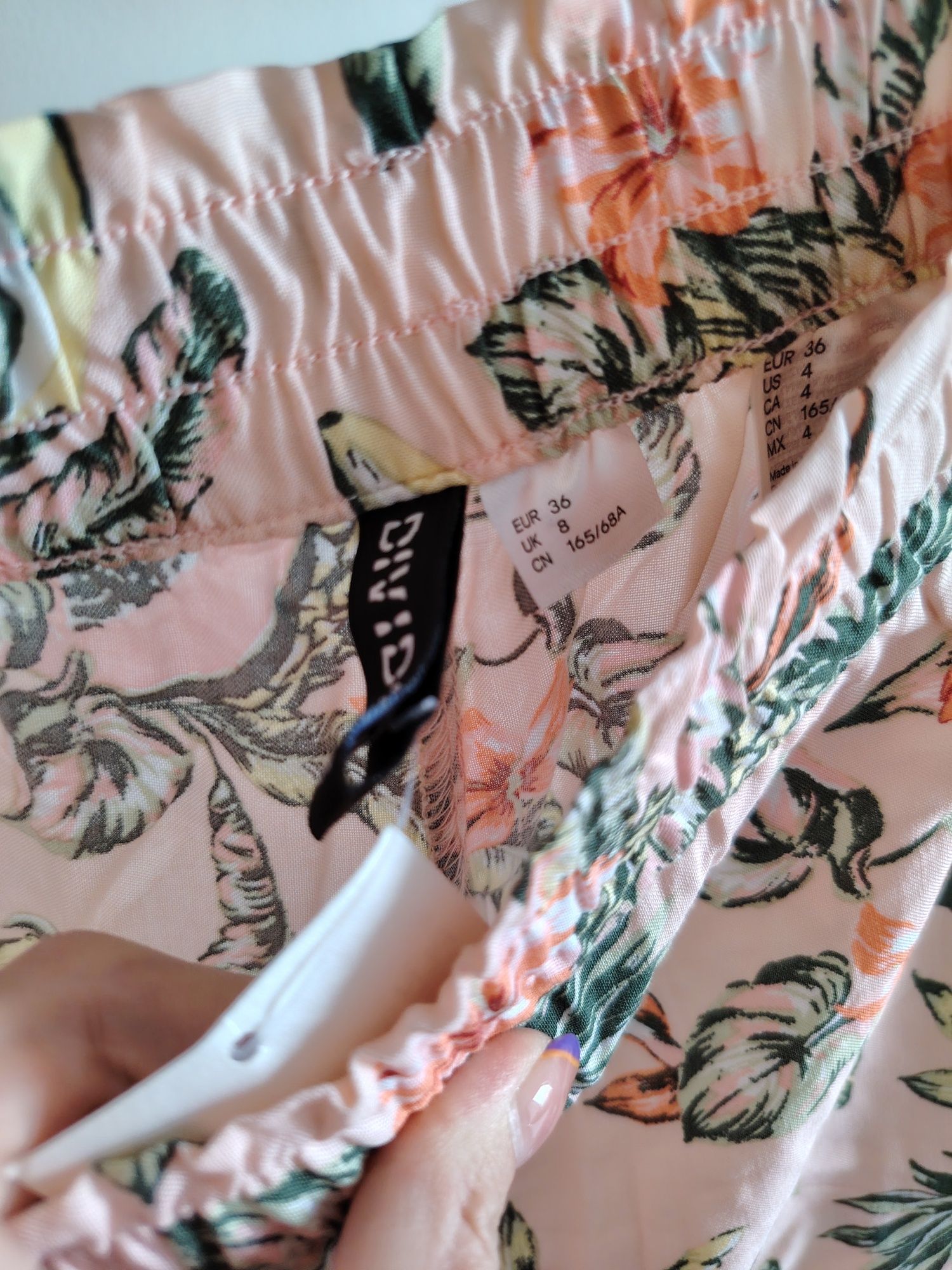 H&M nowe spodnie pudrowy róż kolorowe wzory 36