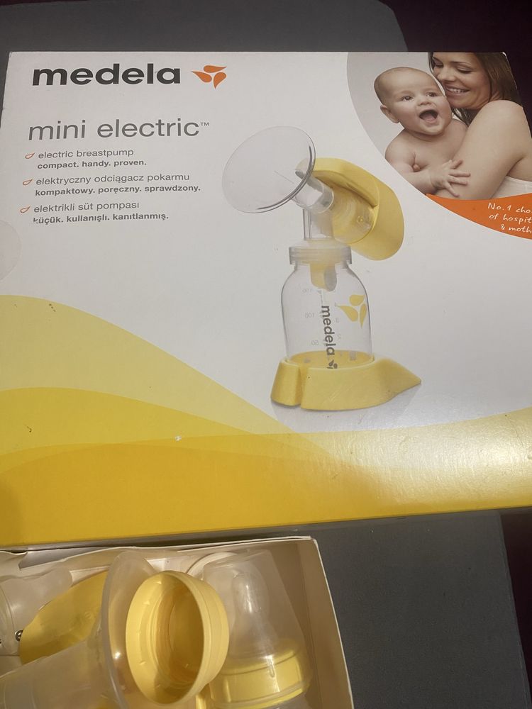 Laktator Medela z butelką magiczną oraz przyjemne gratisy