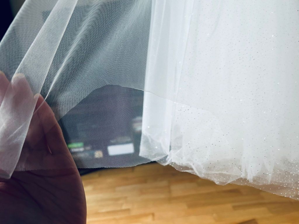 Suknia ślubna szyta z projektu przez salon Scarlett