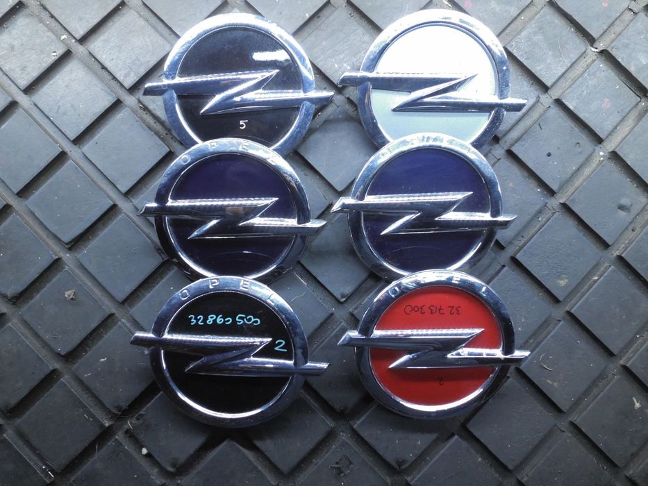 LOGO PRZYCISK KLAPY TYLNEJ OPEL ASTRA J IV HB 13309139