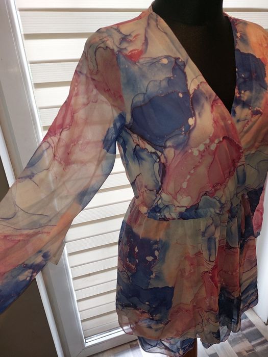 Nowy kombinezon damski kopertowy marmurkowy
Rozmiar S M