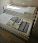 Cama c/cama + arrumação + colchões + roupa cama + edredão + almofadas