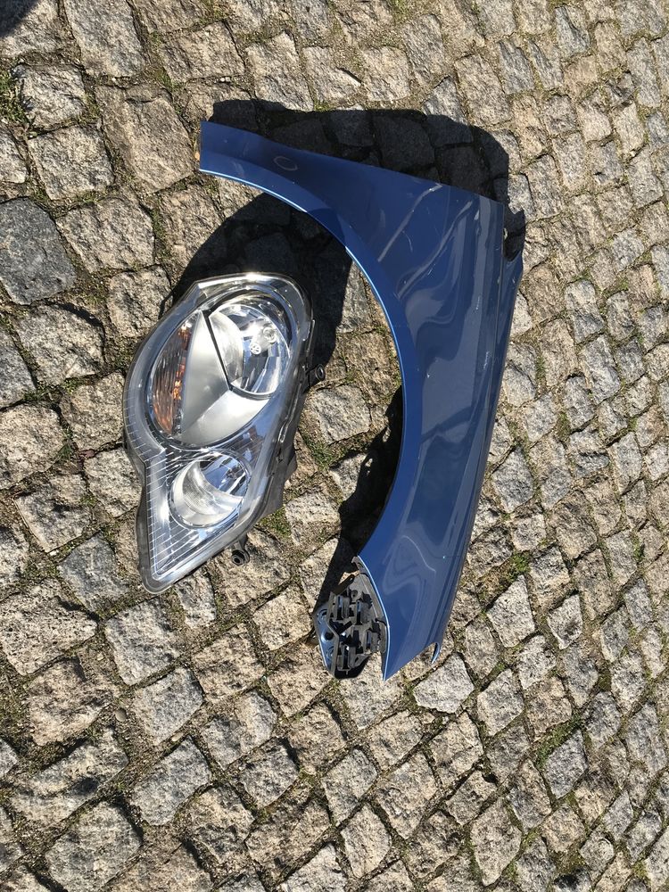 Guarda lamas e farol direito Vw Polo 6Q2 2008