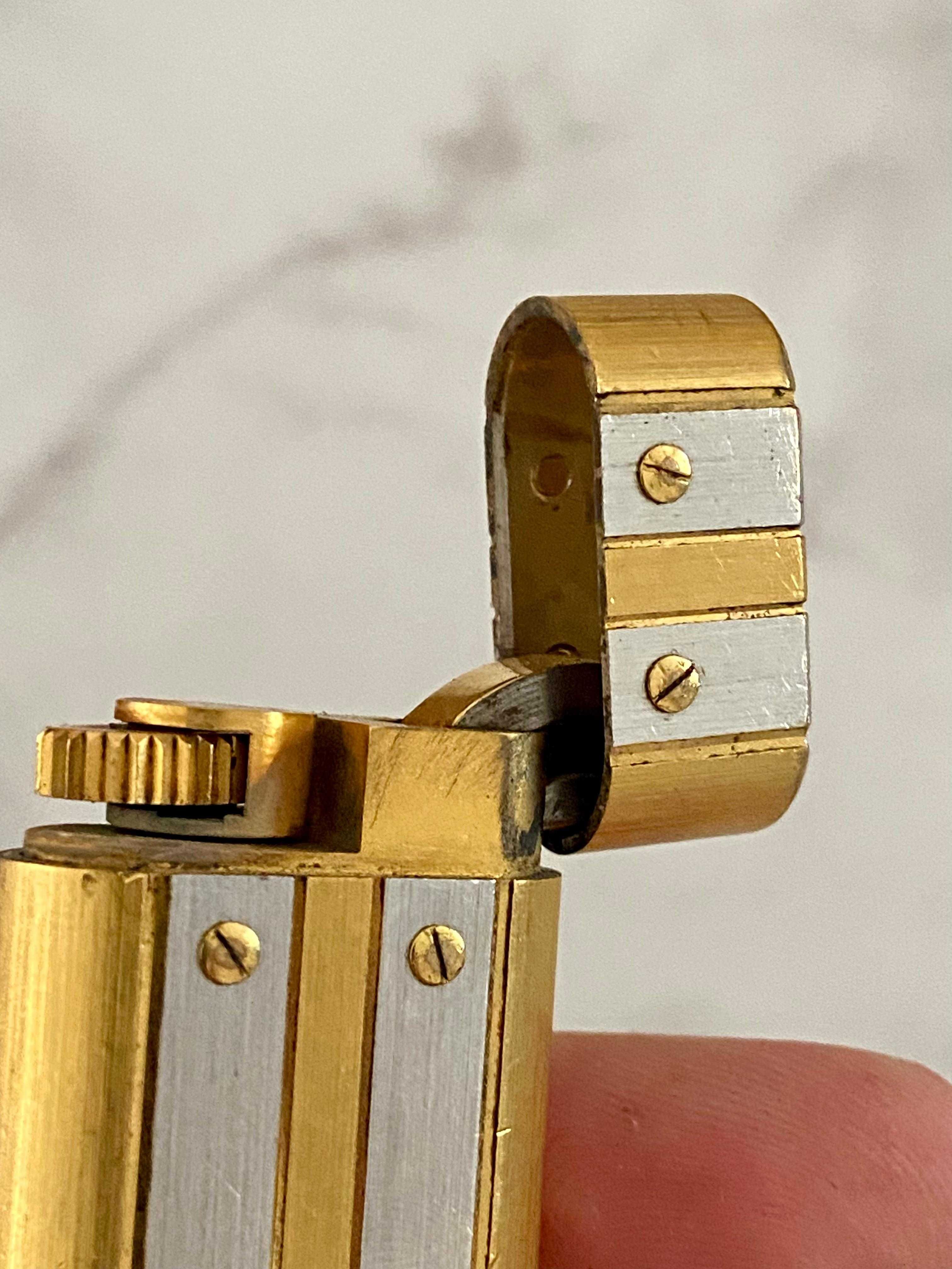 Isqueiro Cartier Santos Prateado e Dourado