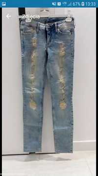 Spodnie damskie jeansy jeans dżins dżinsowe jeansowe rurki H&M dziury