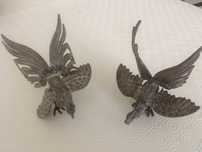 Galos decorativos em bronze