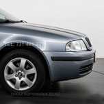 Nowy BŁOTNIK SKODA OCTAVIA I prawy lub lewy Srebrny 9102 LF7T w KOLOR