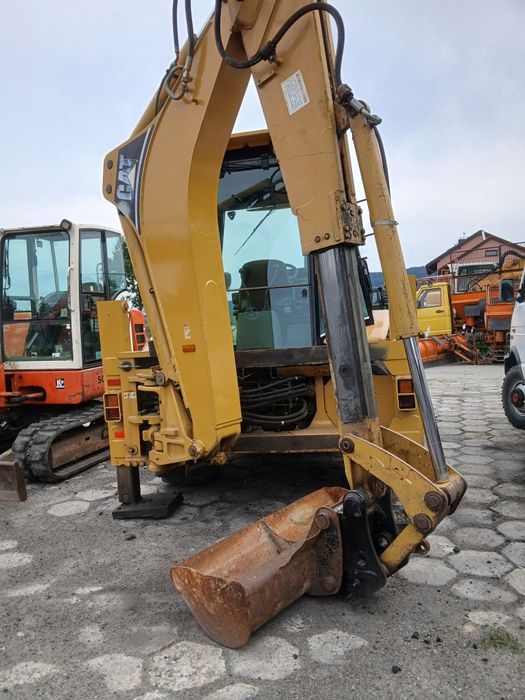 Koparko-ładowarka CAT 428D JCB CASE VOLVO