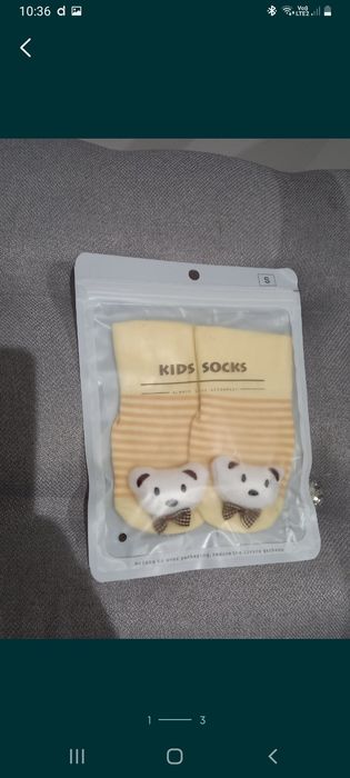 Nowe skarpetki dla niemowlaka w wieku od 3-9 miesiaca.Kremowe z misiem