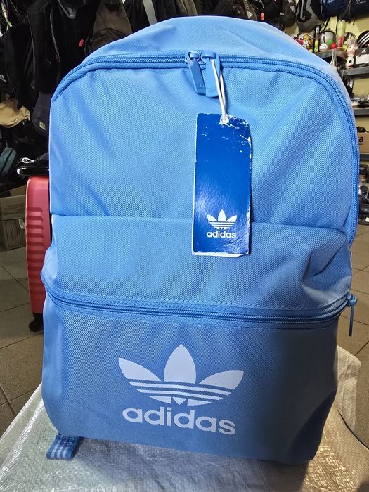 Рюкзак Adidas Adicolor – напівсиній вибух
великий з принтом IR5437