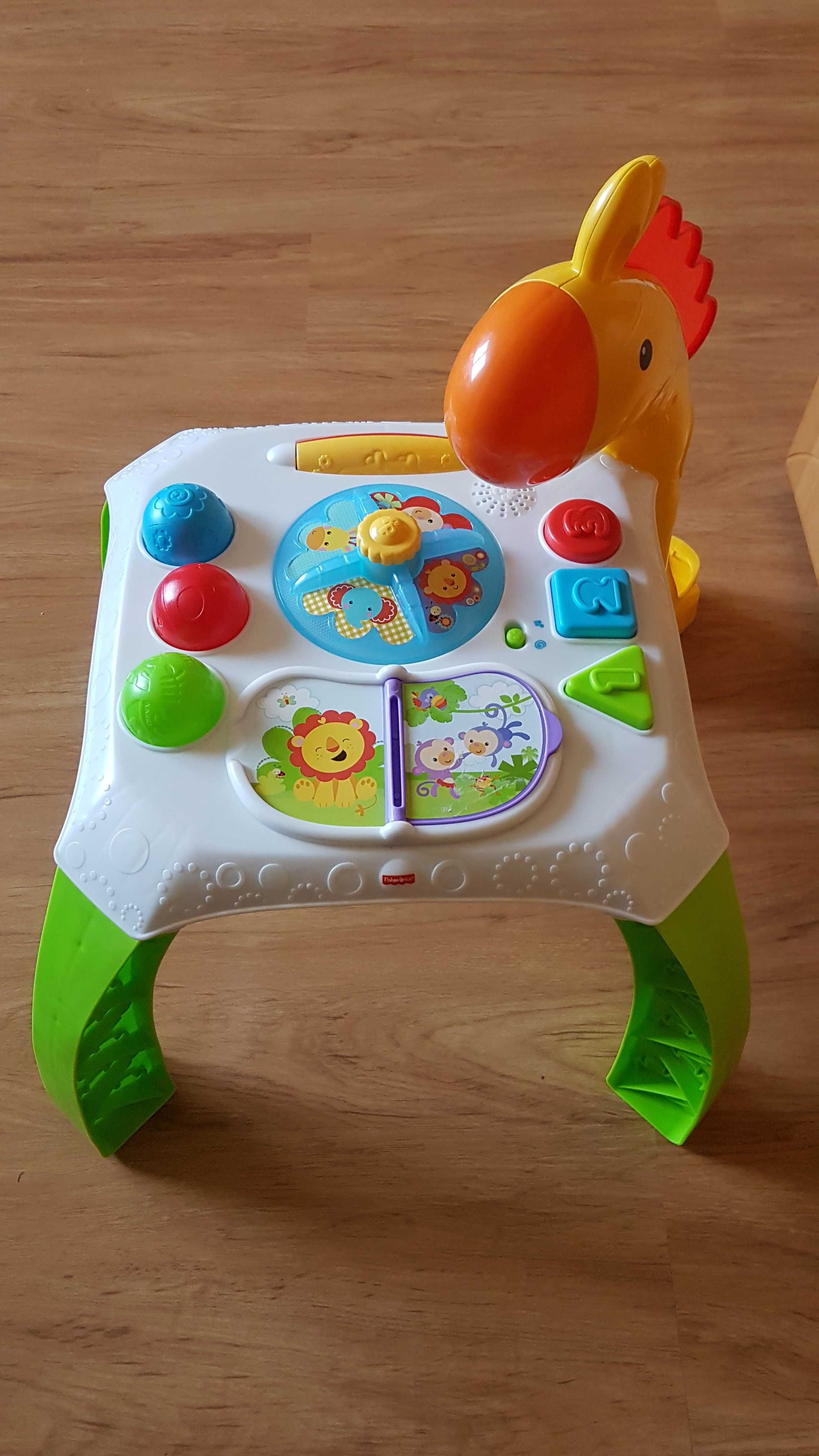 Stolik edukacyjny firmy FISHER PRICE.