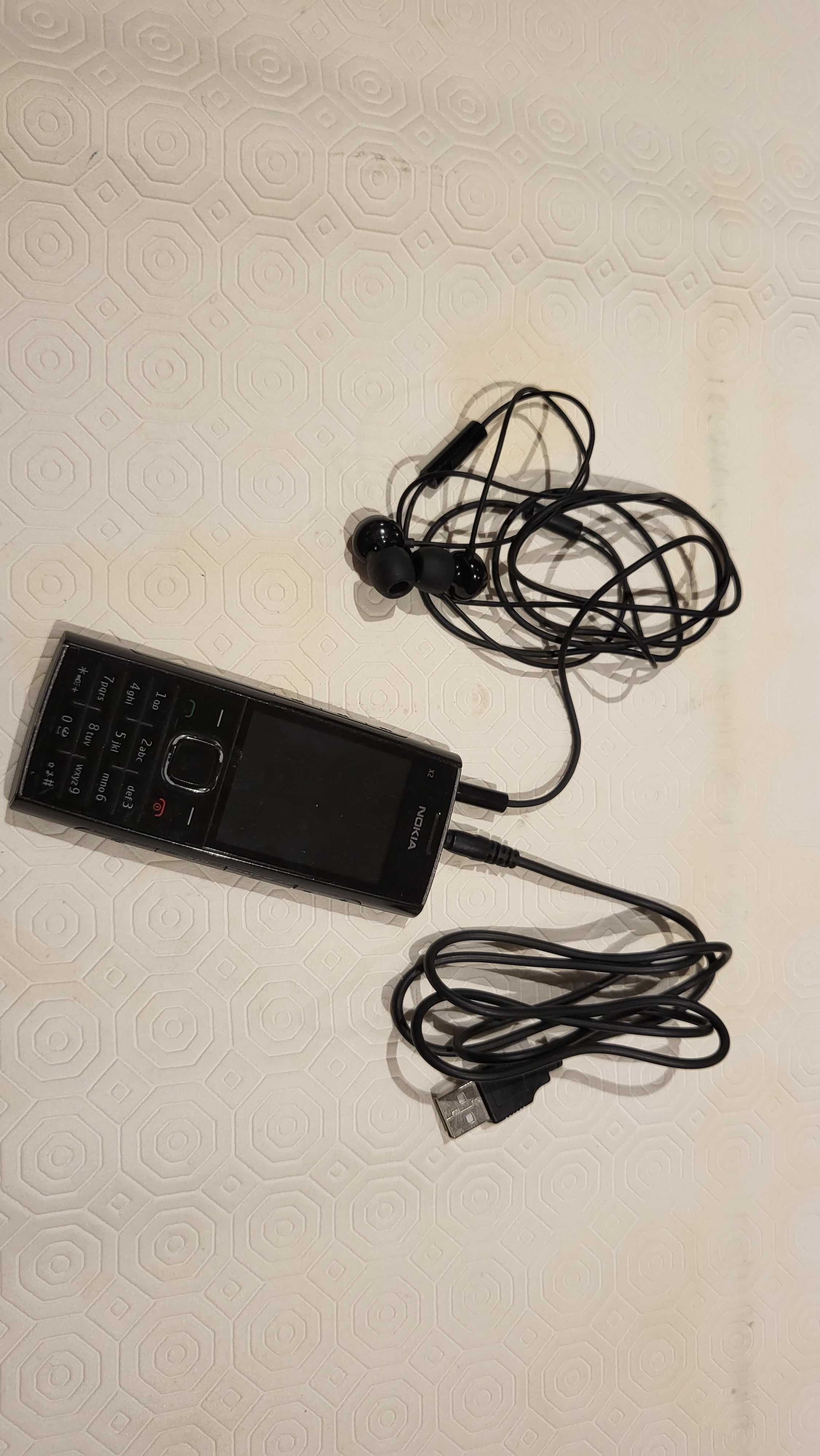 Nokia X2 com auricular e cabo carregamento