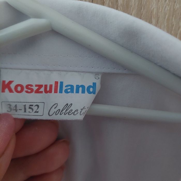 Biała koszula r. 152
