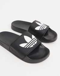 Adidas Adilette чорного кольору. Розмір: us7 / 25.5cm
