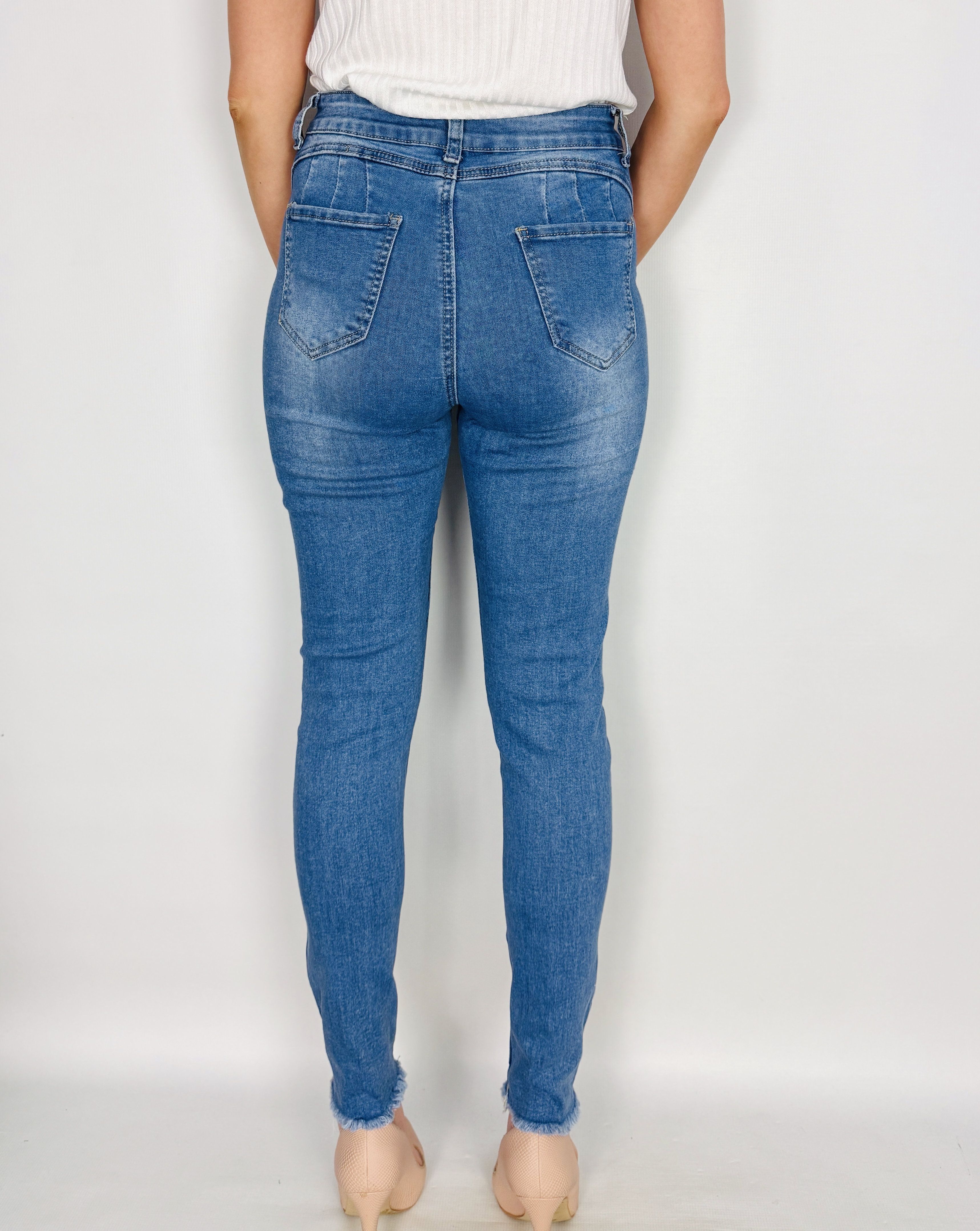 Jasnoniebieskie jeansowe spodnie rurki z przetarciami S 36