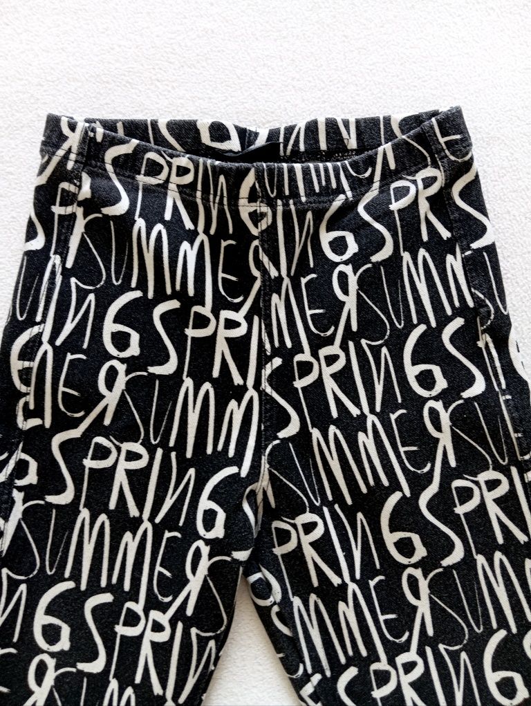 R. 36 legginsy czarne, z białymi napisami