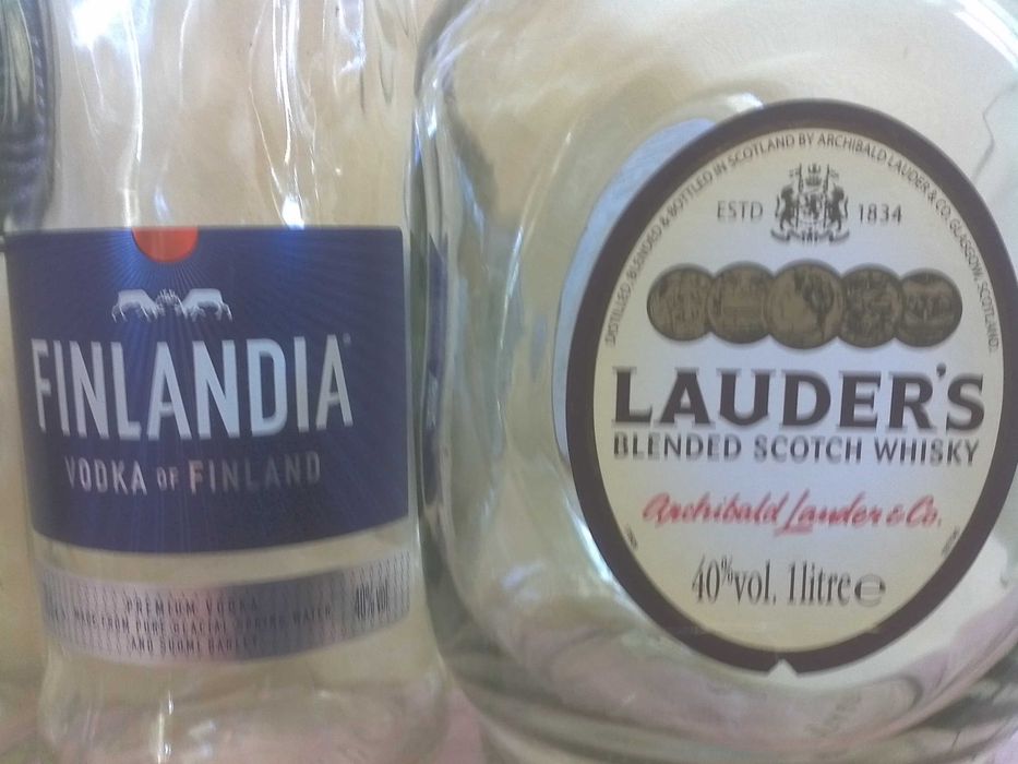 Бутылки из под  водки.