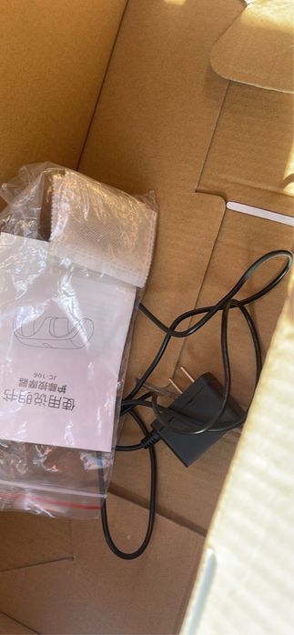 Massageador, novo na caixa sem nenhum vestigio de uso com carregador