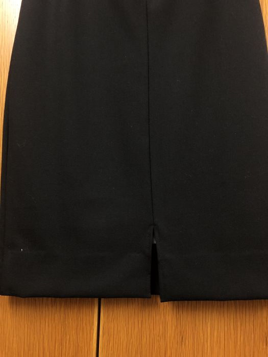 Saia forma preta de lã