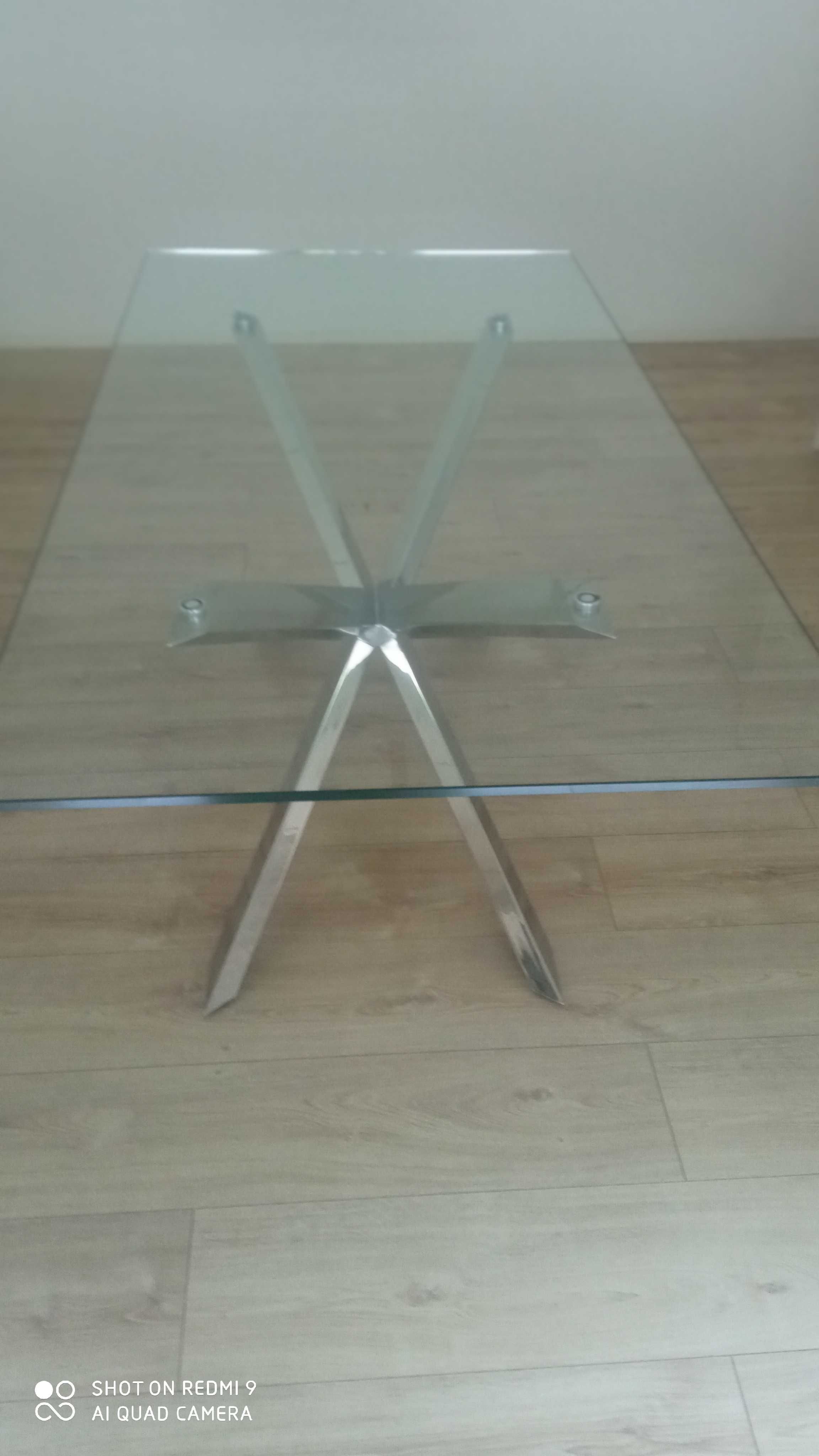 Mesa de vidro com pé em inox