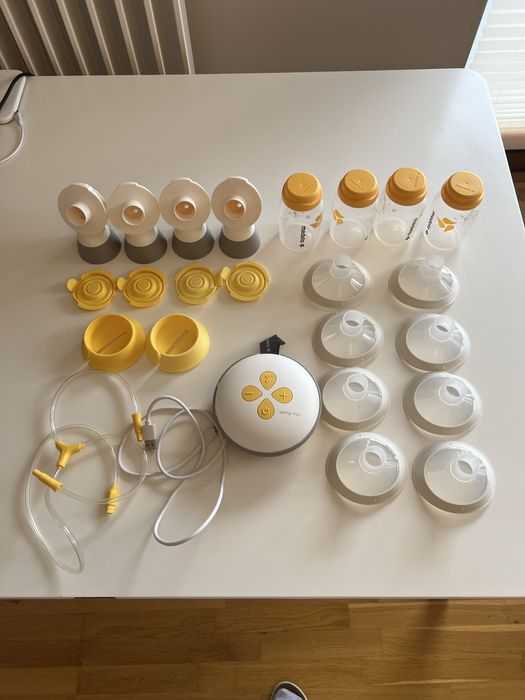 Laktator Medela Swing Maxi + dodatkowe buteleczki, adaptery i lejki