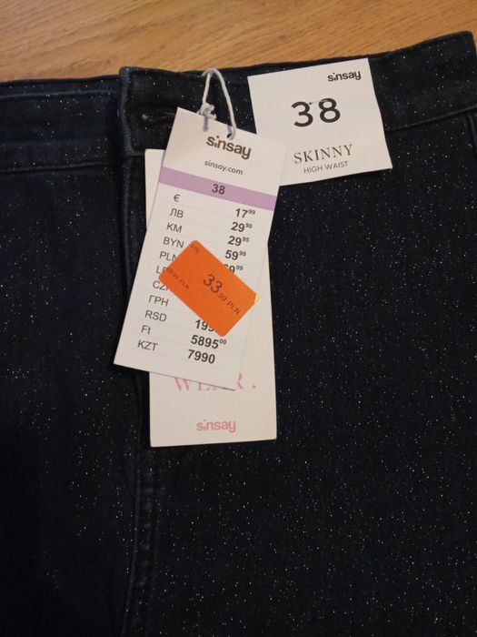 Spodnie błyszczące Sinsay 38