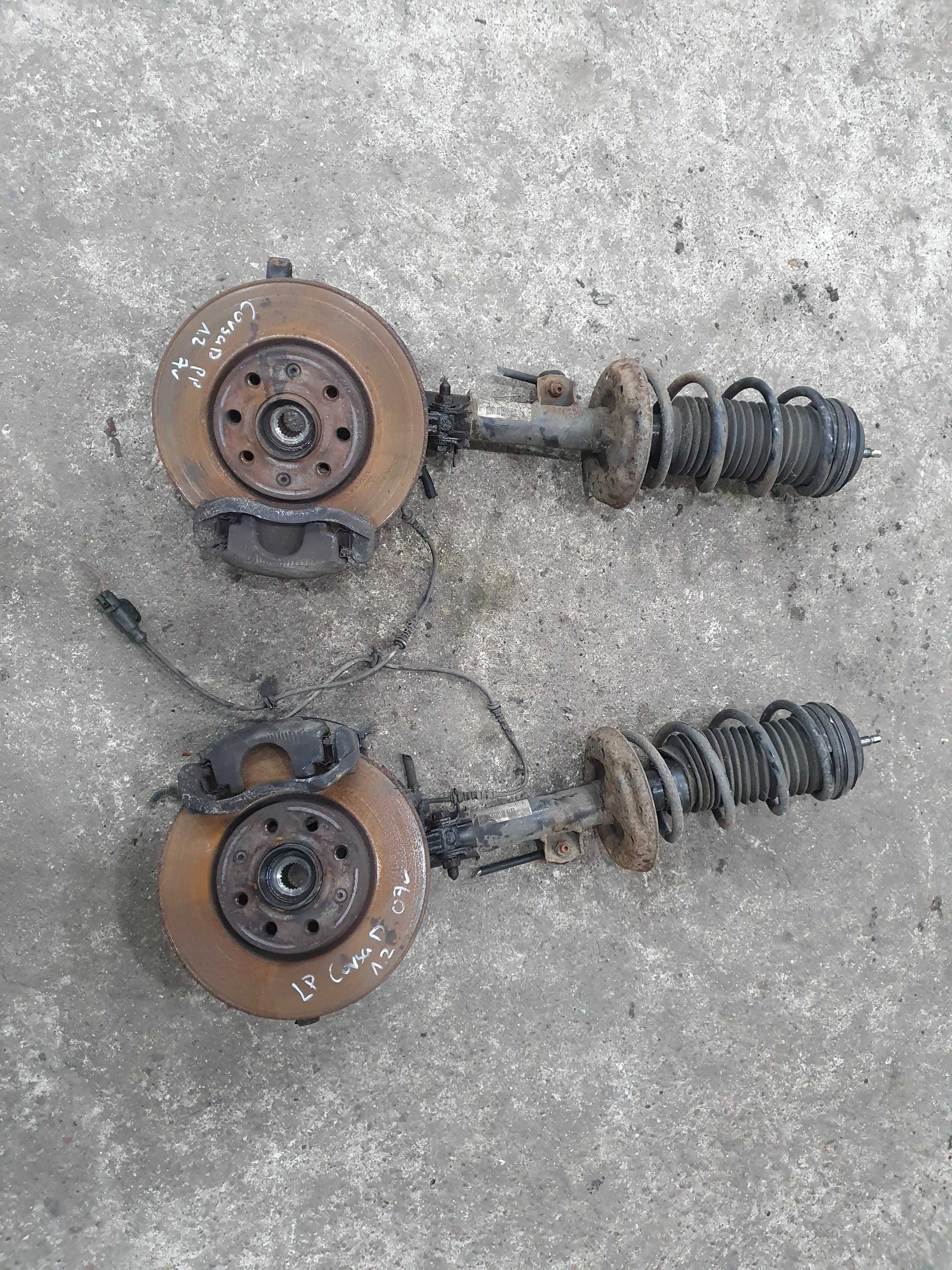 Amortyzator piasta zwrotnica zacisk sprezyna Opel Corsa D 1.2