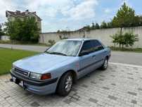 Mazda 323 , 1,4 бензин , магнітола , центральний замок