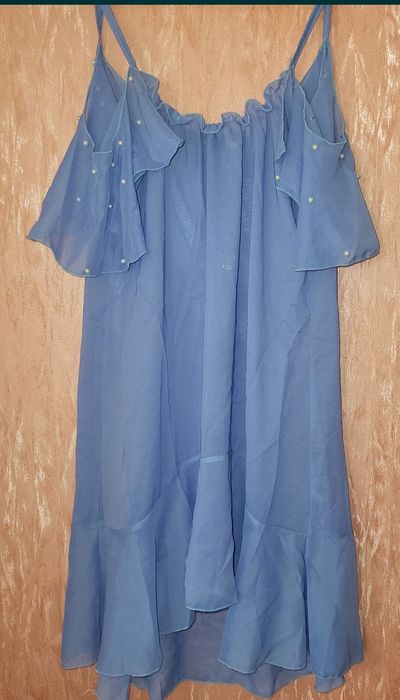 Туника парео с воланом на плечах и жемчугом 44р
Длина 88
Пог 44