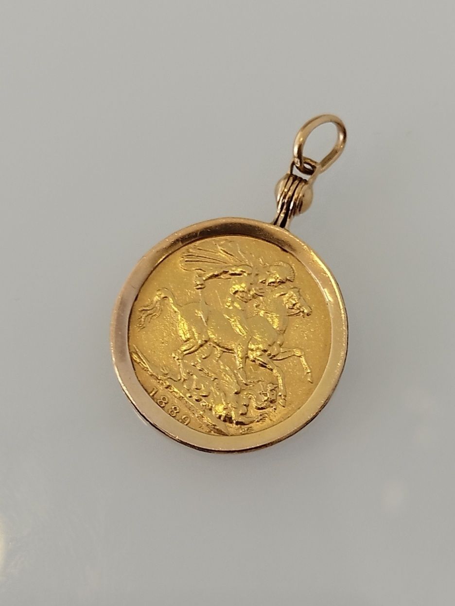 Medalha libra em ouro de 22kt com aro de 19,2kt