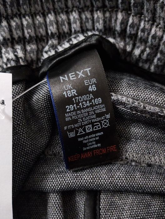 Szare spodnie z szerokimi nogawkami plus size 46