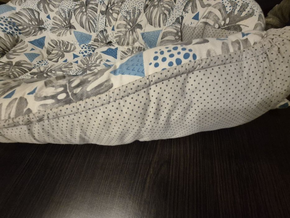 Kokon do spania dla niemowlaka
