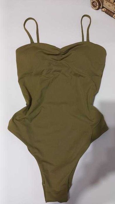 Суцільний зелений купальник розмір s