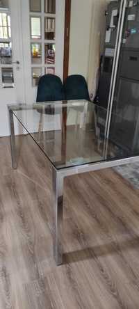 Mesa de vidro com pés de inox